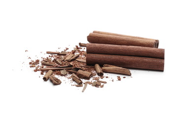 Cinnamon sticks with powder and shavings, macro isolated on white background