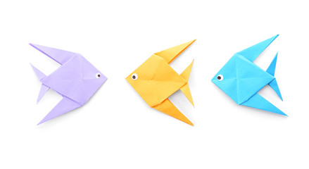 Origami fish on white background