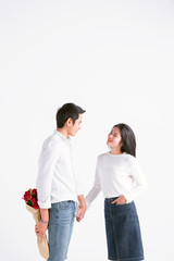 valentines day, love and people concept - happy couple with red heart shaped balloons, Roses, Big Red heart Paper over white background