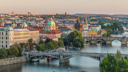 Fototapeta na wymiar Aerial sunset view of the Vltava River and bridges evening timelapse, Prague