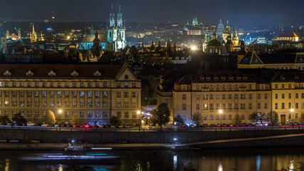Fototapeta na wymiar Night Panorama of Prague with Vltava river timelapse.