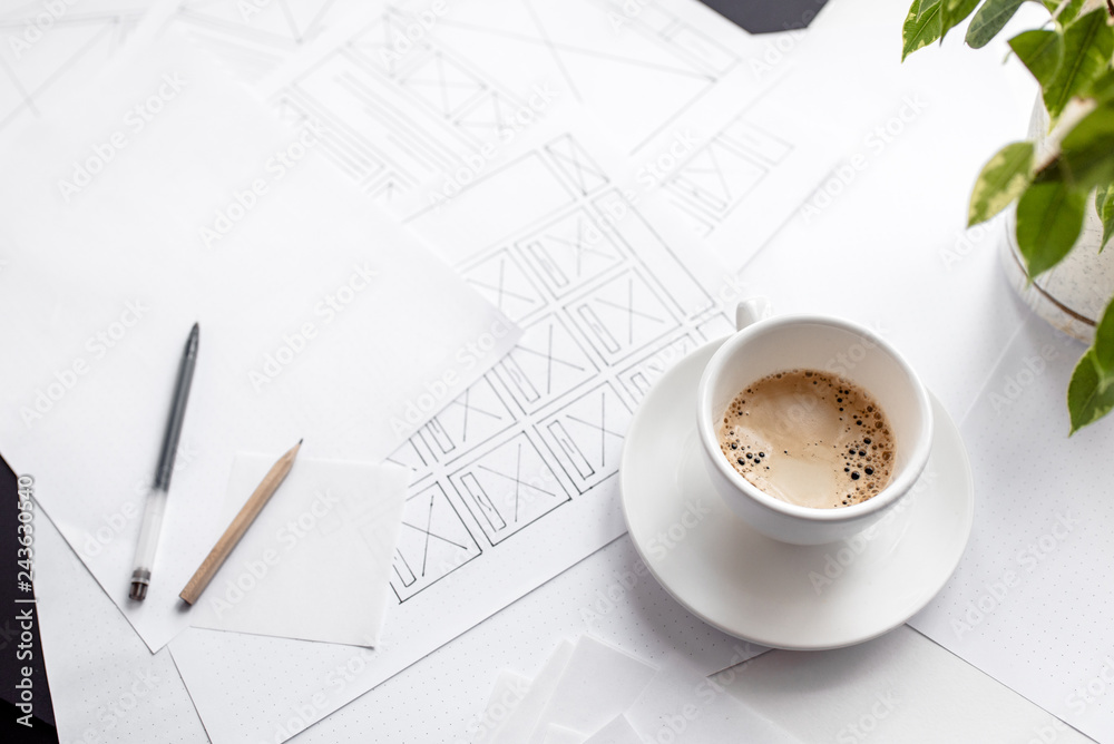 Wall mural ux website designer drawing wireframe sketch of prototype, framework, layout future project. creativ
