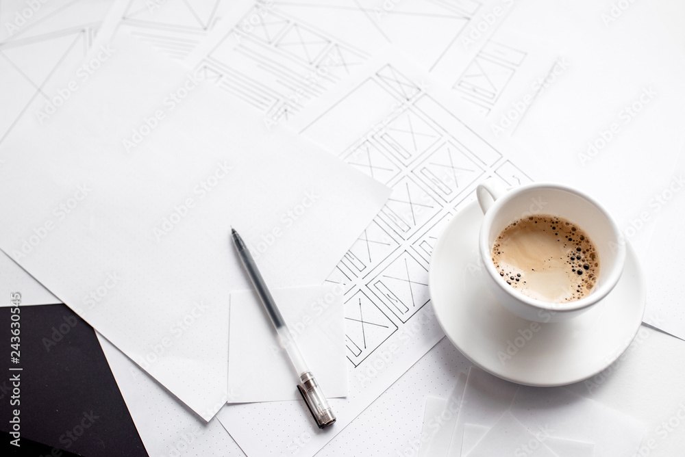 Wall mural ux website designer drawing wireframe sketch of prototype, framework, layout future project. creativ