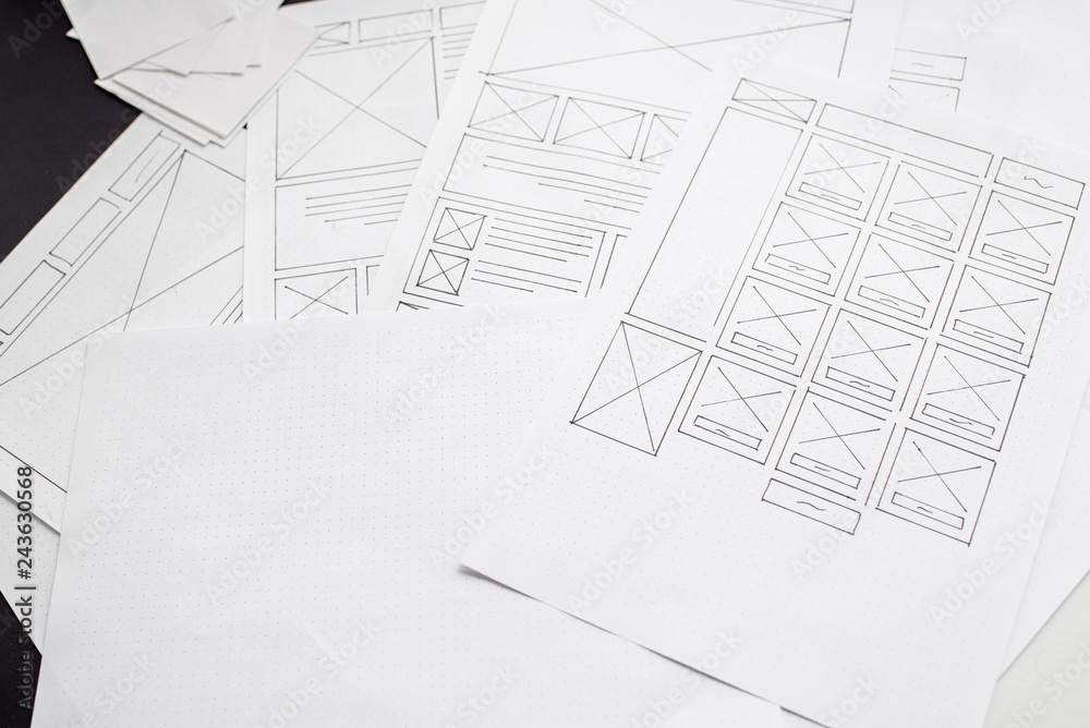 Wall mural ux website designer drawing wireframe sketch of prototype, framework, layout future project. creativ