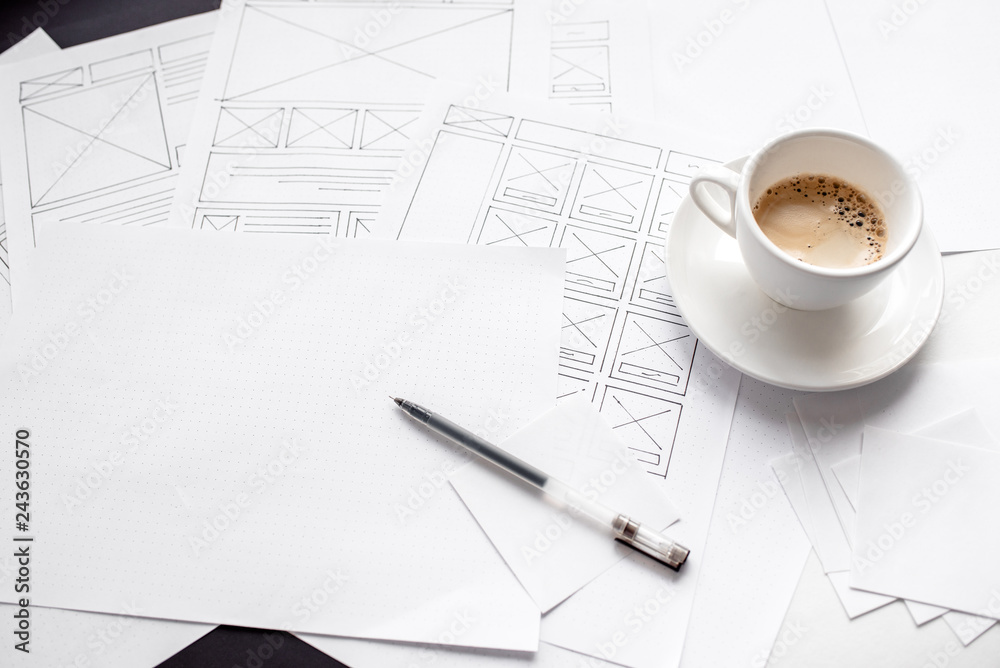 Wall mural ux website designer drawing wireframe sketch of prototype, framework, layout future project. creativ