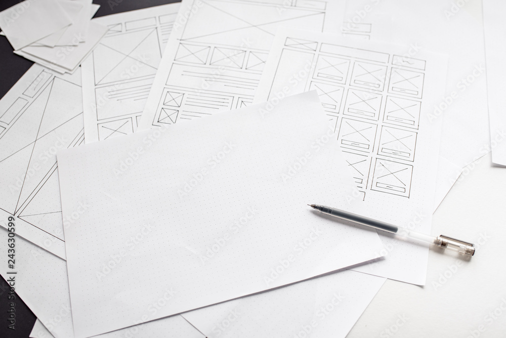 Wall mural ux website designer drawing wireframe sketch of prototype, framework, layout future project. creativ