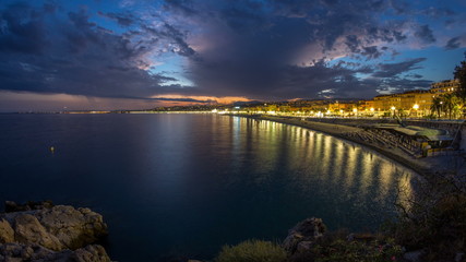 Waterfront of Nice city and Mediterranean Sea day to night timelapse