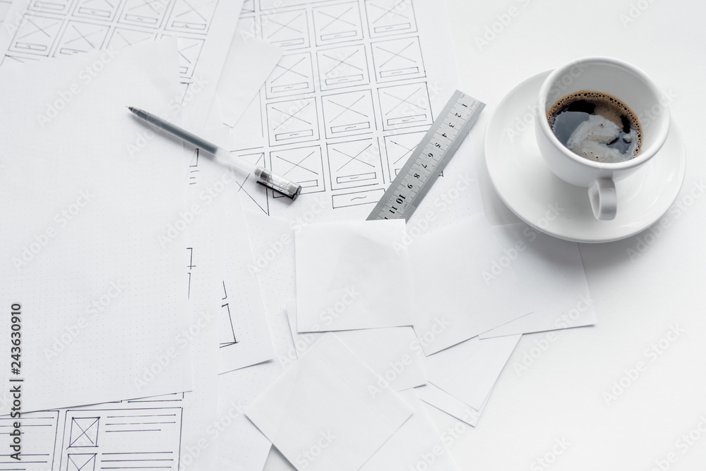 Wall mural ux website designer drawing wireframe sketch of prototype, framework, layout future project. creativ