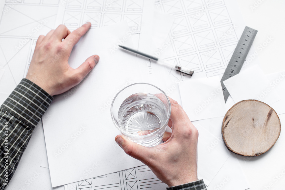 Wall mural ux website designer drawing wireframe sketch of prototype, framework, layout future project. creativ