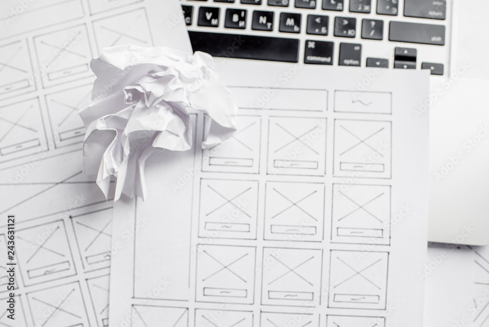 Wall mural ux website designer drawing wireframe sketch of prototype, framework, layout future project. creativ
