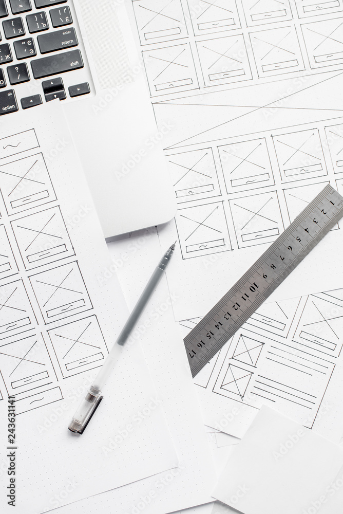 Wall mural ux website designer drawing wireframe sketch of prototype, framework, layout future project. creativ