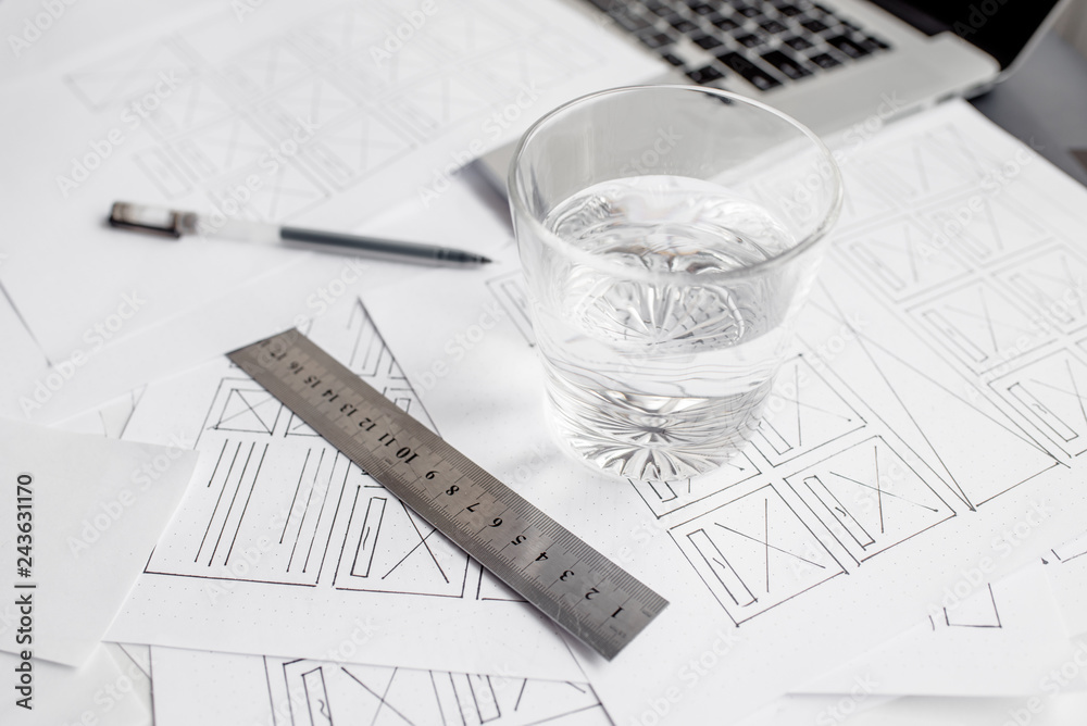 Wall mural ux website designer drawing wireframe sketch of prototype, framework, layout future project. creativ