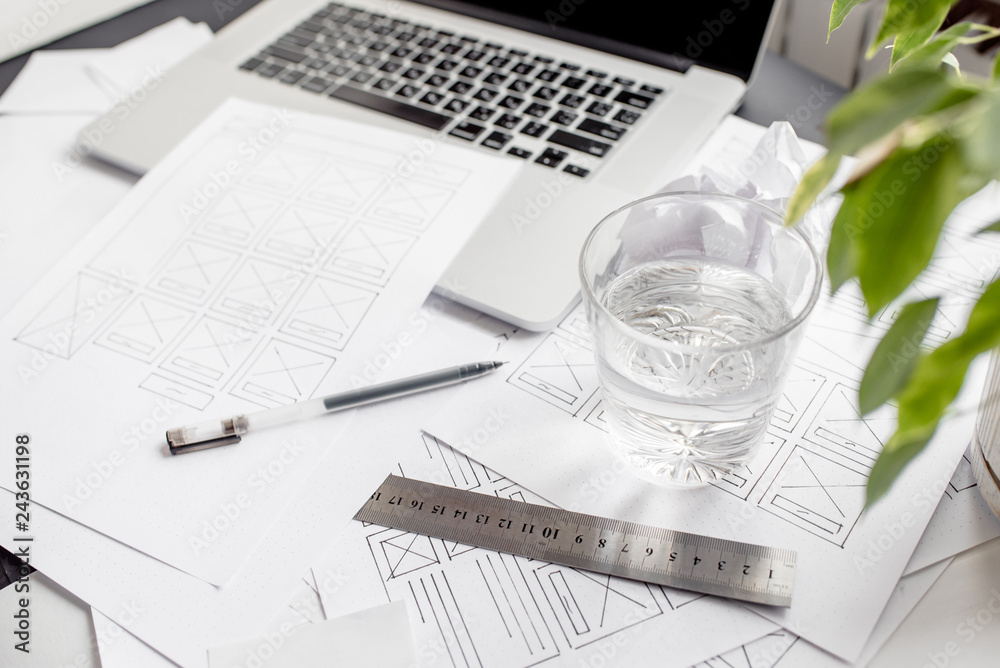 Wall mural ux website designer drawing wireframe sketch of prototype, framework, layout future project. creativ