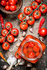 Pickled tomatoes with garlic and spices.