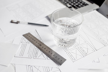 UX website designer drawing wireframe sketch of prototype, framework, layout future project....