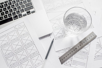 UX website designer drawing wireframe sketch of prototype, framework, layout future project....