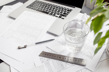 UX website designer drawing wireframe sketch of prototype, framework, layout future project....