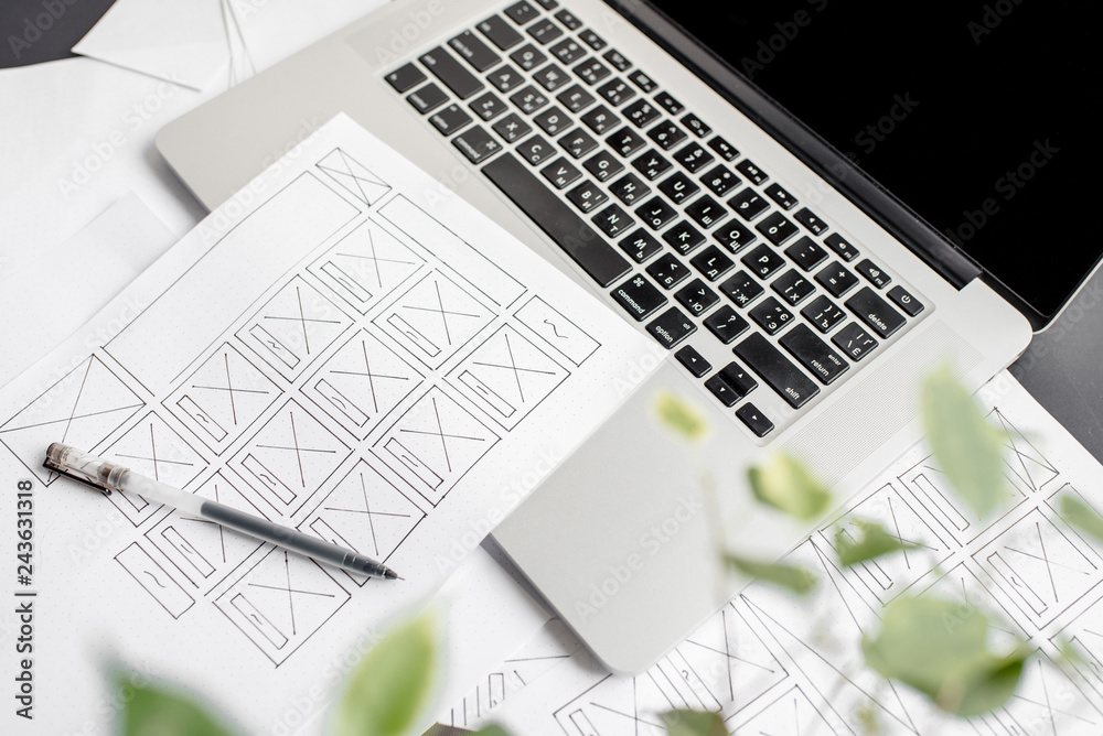 Wall mural ux website designer drawing wireframe sketch of prototype, framework, layout future project. creativ