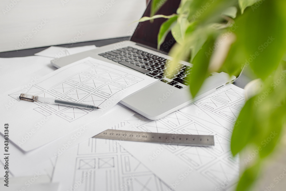 Wall mural ux website designer drawing wireframe sketch of prototype, framework, layout future project. creativ