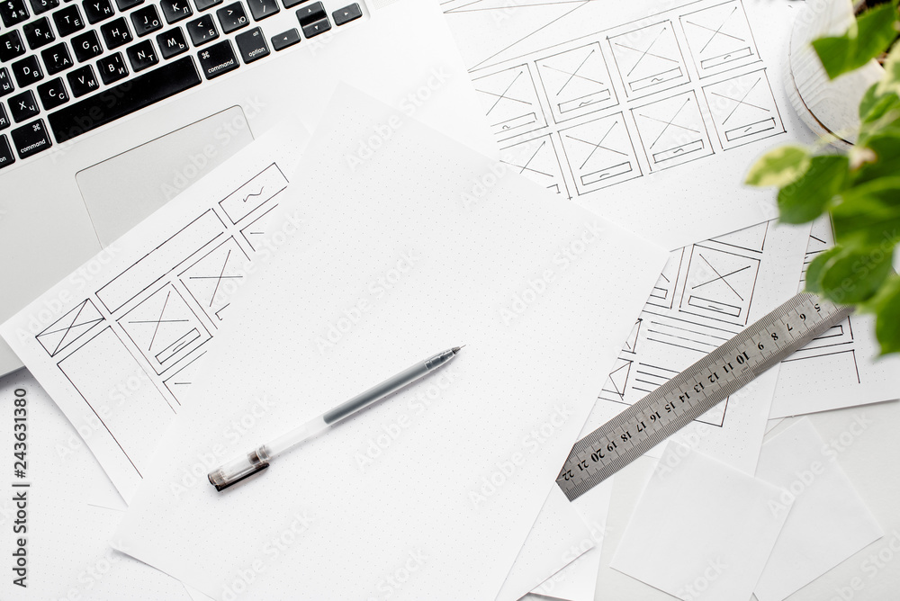 Wall mural ux website designer drawing wireframe sketch of prototype, framework, layout future project. creativ