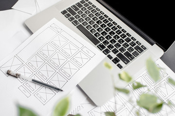 UX website designer drawing wireframe sketch of prototype, framework, layout future project....