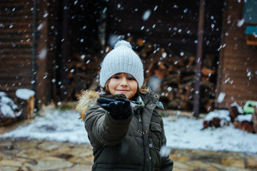 Fototapeta na wymiar boy enjoy snow snowing winter fun nordic