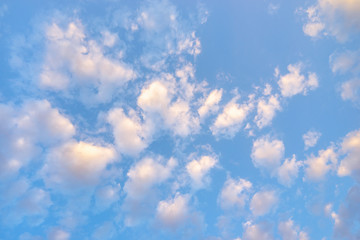 Blue sky with clouds. Scattered white clouds in the blue sky for text background.  