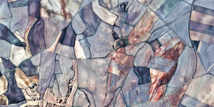 fields of dreams, tribute to Picasso, abstract photography of the Spain fields from the air, aerial view, representation of human labor camps, abstract, cubism, abstract naturalism,