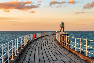 Whitby, North Yorkshire, England, UK - looking at the West Pier