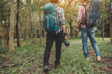 Hiking man with backpack using camera in mountains, Travel lifestyle success concept adventure