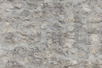 The texture of the walls made of stones bonded with cement