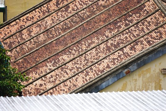 Multi colored tile roof with parallel lines abstract diagonal background texture