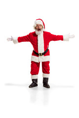 Hey, hello. Holly jolly x mas festive noel. Full length of funny happy santa in headwear, costume, black belt, white gloves, waves with arm palm standing at studio over white background