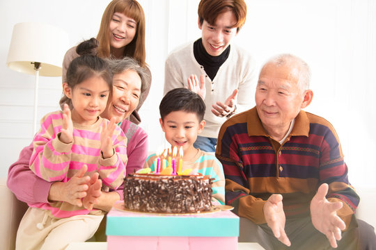 happy asian Family celebrating child's birthday