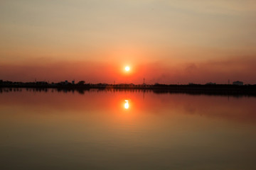 Naklejka na ściany i meble sunset reflection in the lake