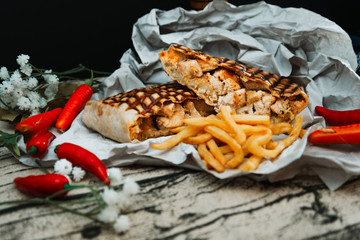 Mexican fajita wraps with grilled chicken fillet and fresh vegetables