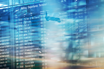 Flights information departures board in airport terminal.