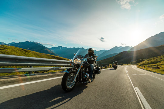 Fototapeta Motorcycle driver riding in Alpine highway, Hochalpenstrasse, Austria, Europe.