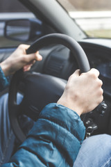 Man hands on the steering wheel
