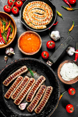 Fried sausages with garlic, herbs and hot chili peppers.