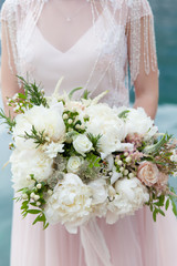 wedding bouquet with white peony and roses