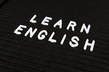Fototapeta premium Learn English language, modern looking sign on black background