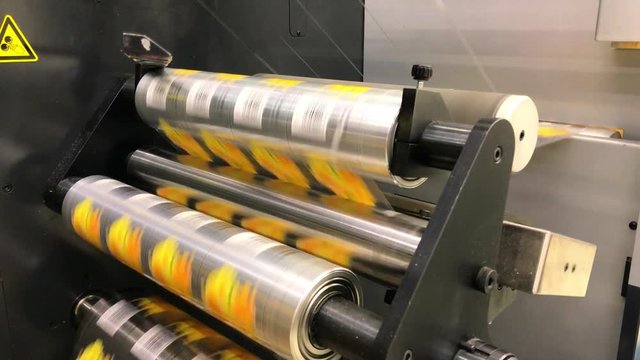 Industrial machine rolling labels with high speed.