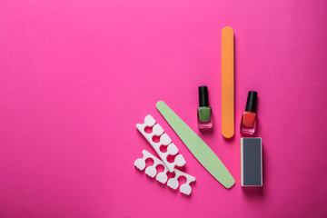Set of pedicure tools on color background