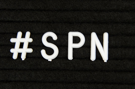 Spanish SPN abbreviation, simple sign on black background, great for teachers, schools, students