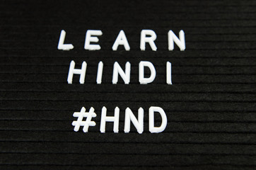 Learn Hindi, simple sign on black background, great for teachers, schools, students