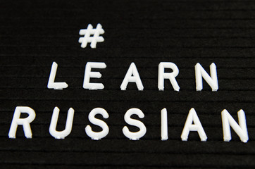 Learn Russian, RUS abbreviation, simple sign on black background, great for teachers, schools, students