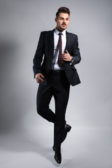 Stylish businessman on grey background