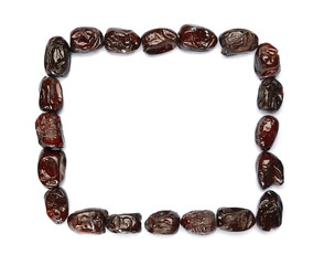 Frame made of sweet dried dates on white background