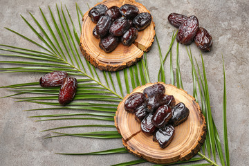 Sweet dried dates on grey background